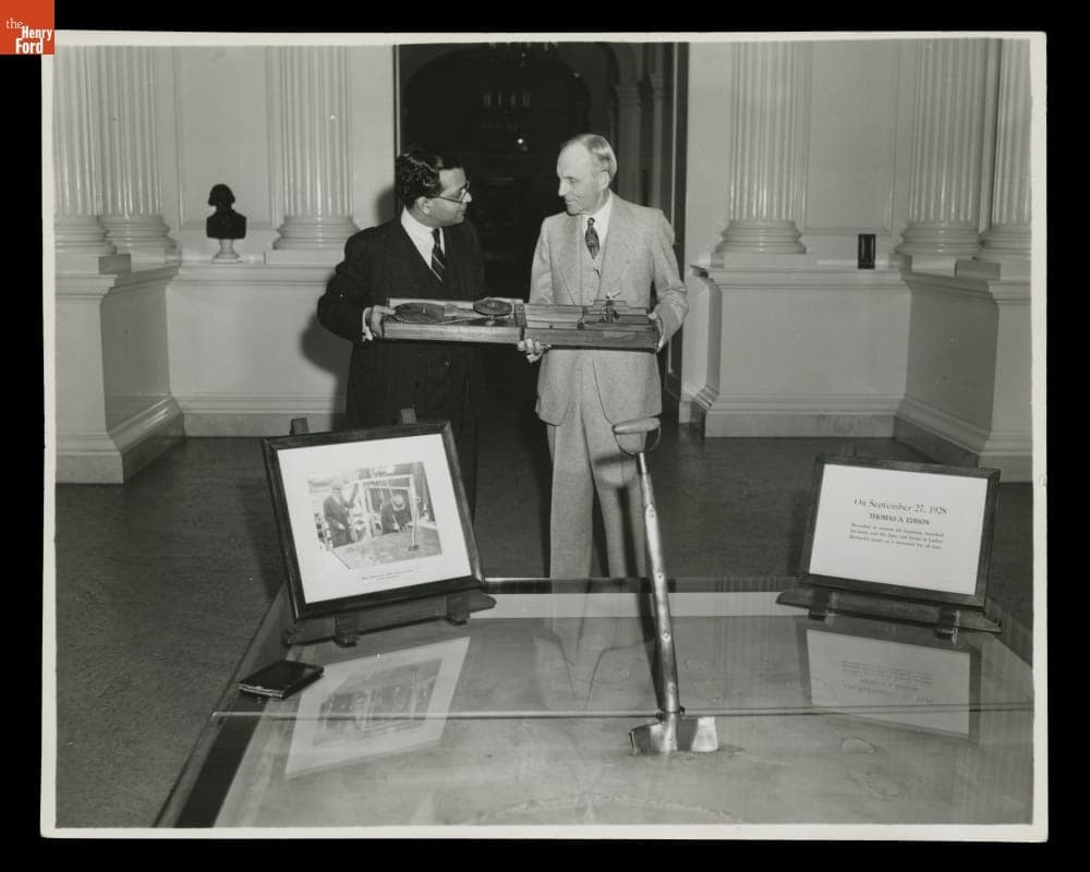 Mr. T. A. Raman Presents a Portable Spinning Wheel to Henry Ford, a Gift from Mahatma Gandhi, 1942