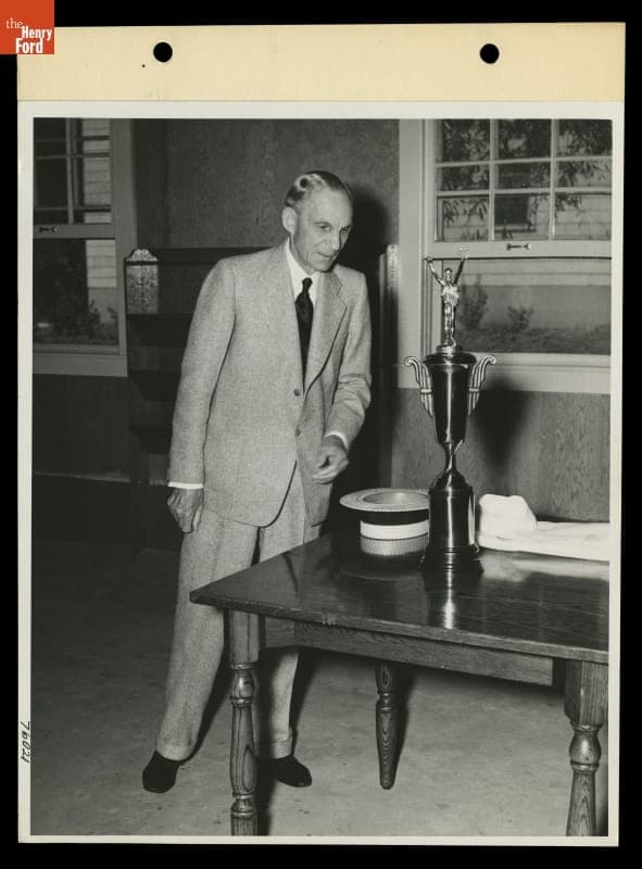 Henry Ford with Trophy Presented to Him from Men Stationed at the Naval Service School, Ford Rouge Plant, August 20, 1941
