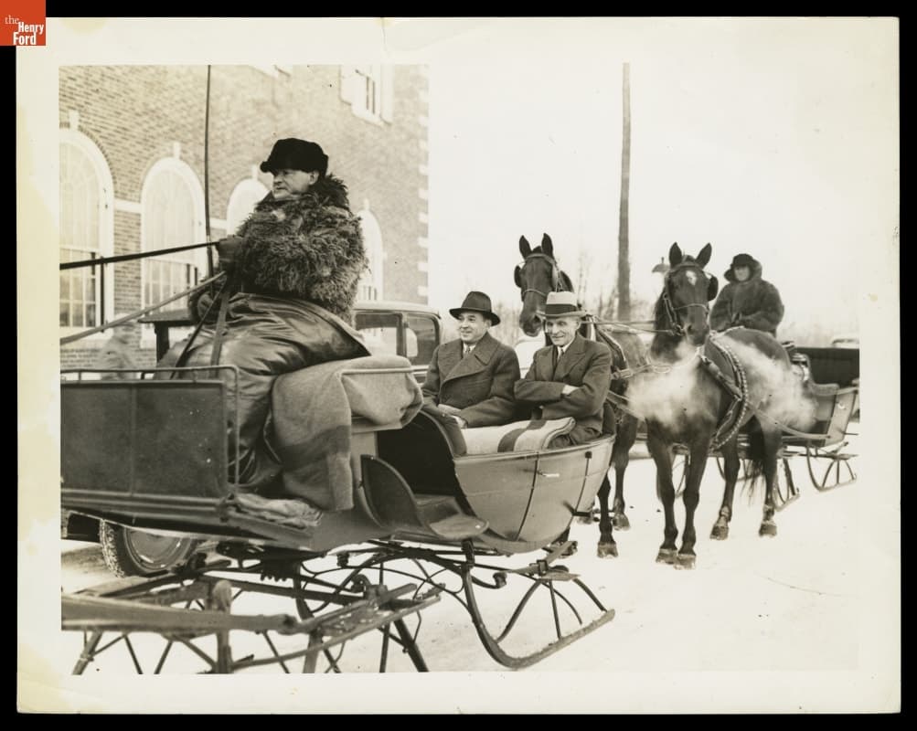 Henry Ford and Edsel Ford in Sleigh, outside Henry Ford Museum, circa 1935