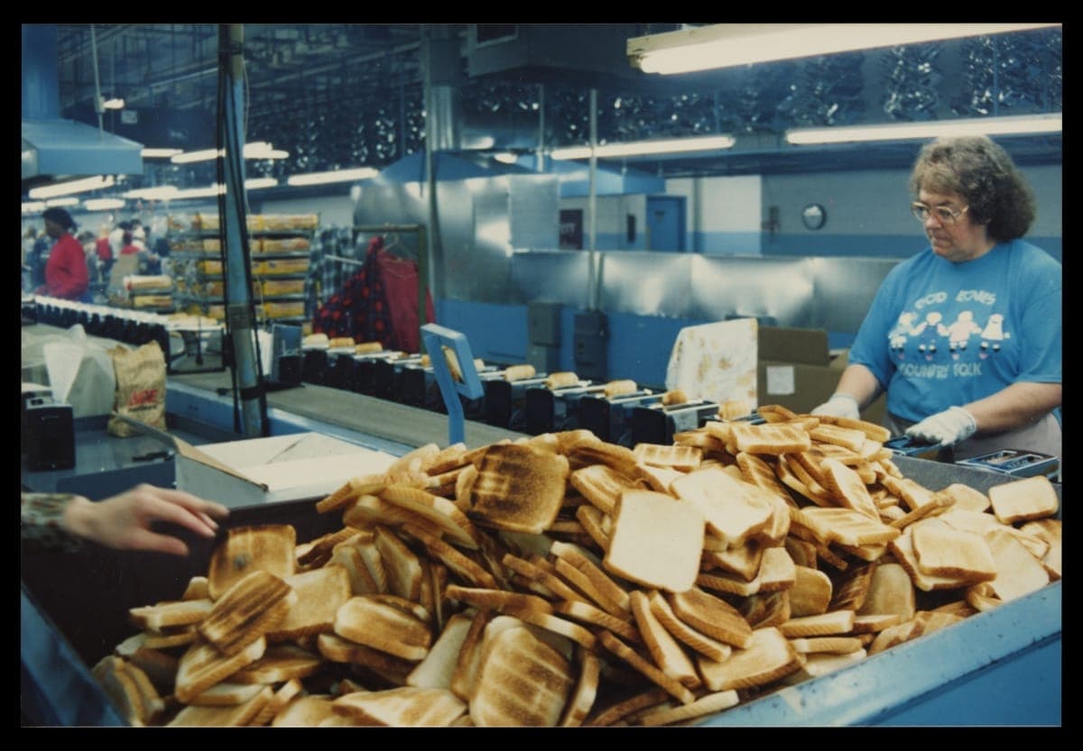 Factory Workers Testing Newly Manufactured Toasters, circa 2000