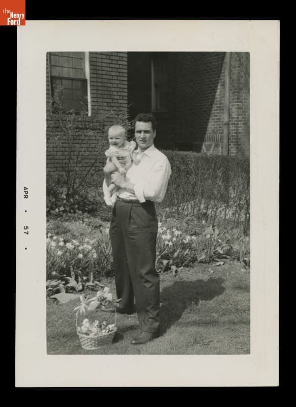 Man Holding Baby Girl next to Easter Basket, 1957