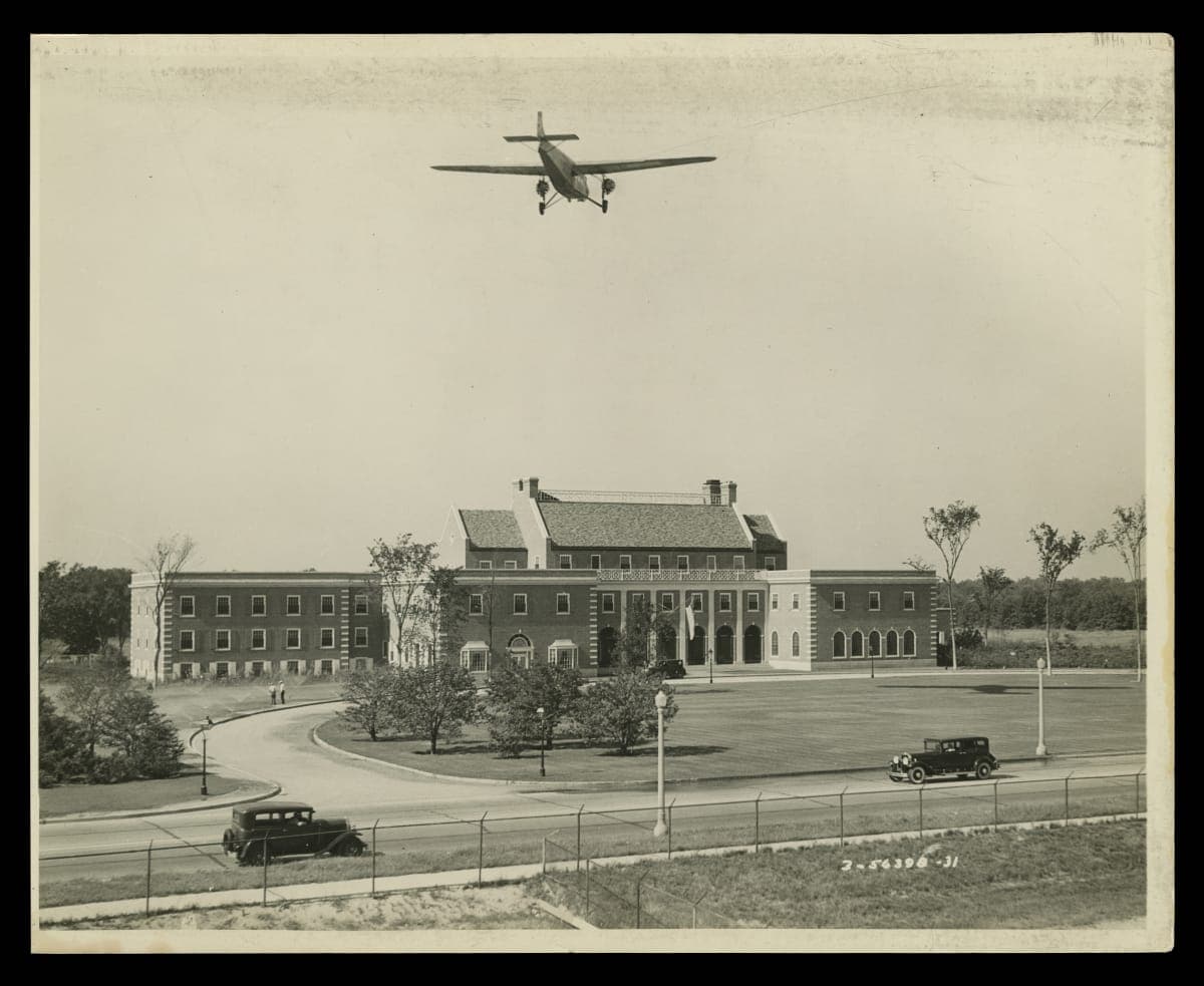Ford Tri-Motor Airplane in Flight over Dearborn Inn, 1931