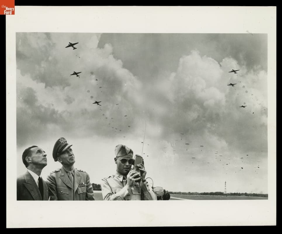 Edsel Ford and Lieutenant General Somervell Watching Demonstration of Paratroop Jumping at Ford Airport, July 4, 1942