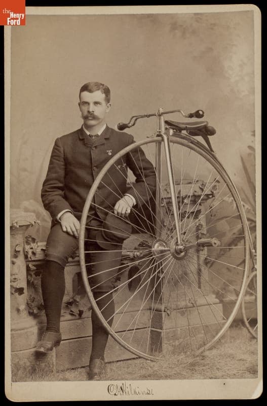 C.H. Wilkins with a High-Wheel Bicycle, 1883