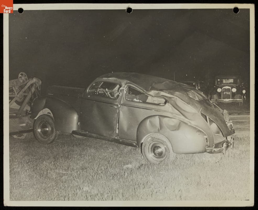 Damaged Car Hooked up to a Tow Truck, 1939