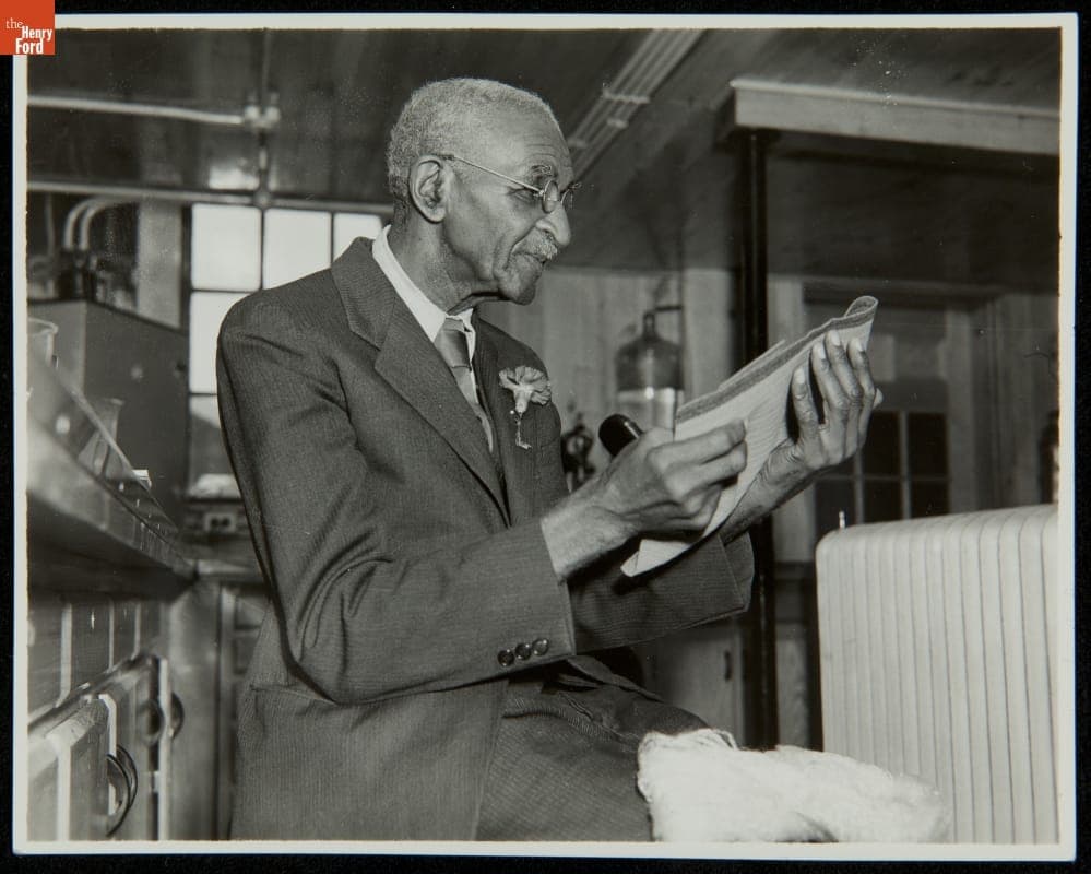 George Washington Carver Holding Fabric Made from Soybean Fiber, Soybean Lab, Greenfield Village, 1939