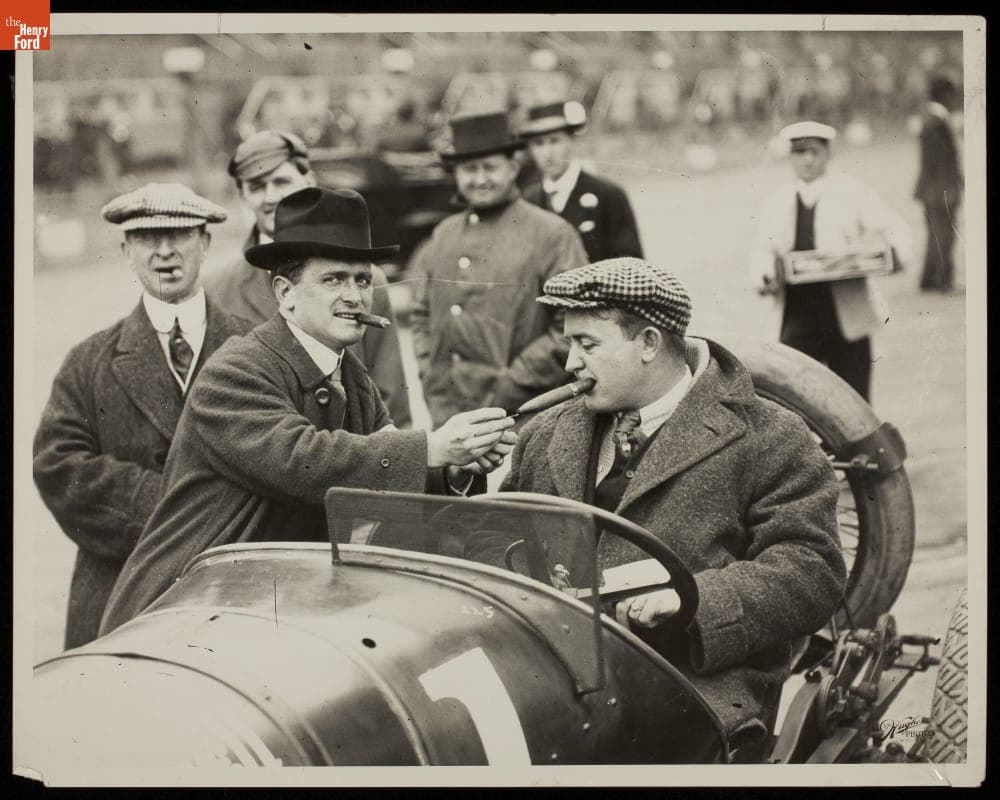 Lincoln Beachey Lighting Barney Oldfield's Cigar, 1914