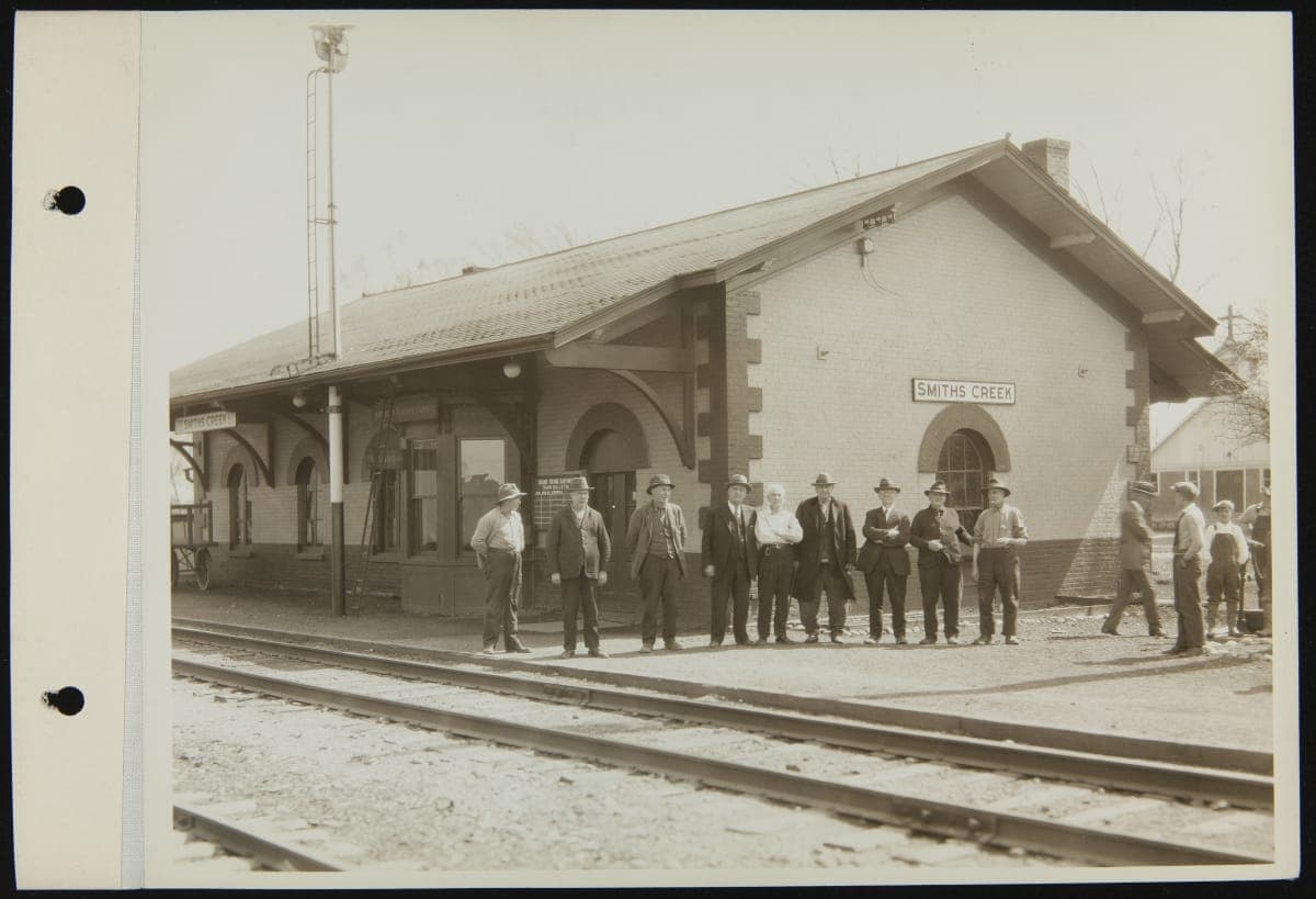Men Standing outside Smiths Creek Depot at its Original Site, Smiths Creek, Michigan, April 1929