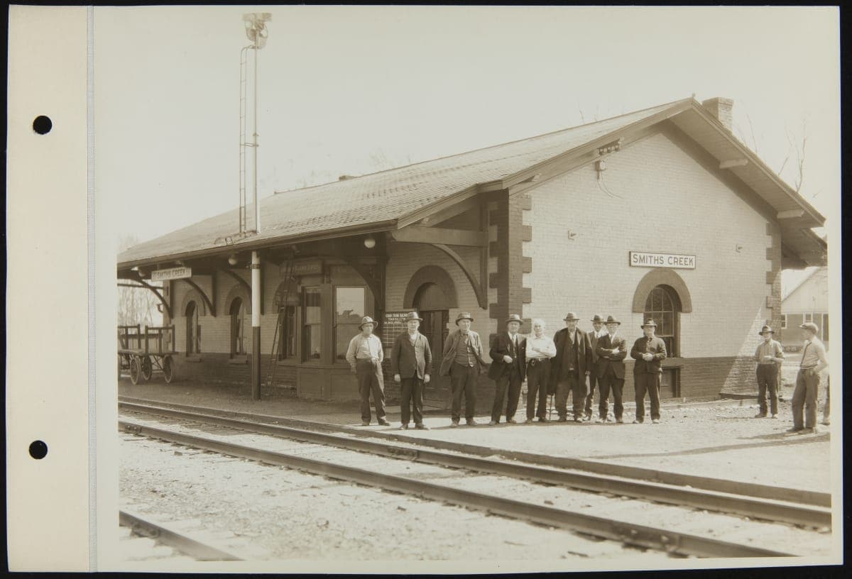 Men Standing outside Smiths Creek Depot at its Original Site, Smiths Creek, Michigan, April 1929