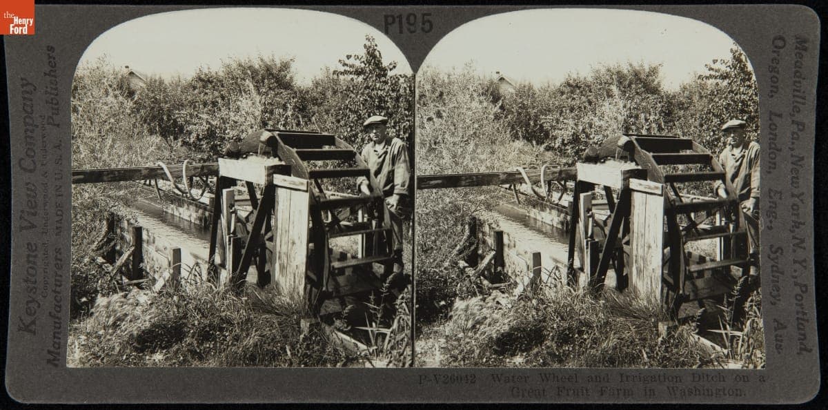 "Water Wheel and Irrigation Ditch on a Great Fruit Farm in Washington," circa 1925