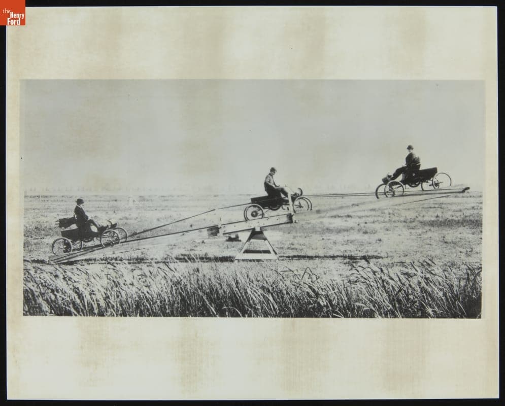 Demonstration of Three 1902 Curved Dash Oldsmobiles on a Seesaw, 1902