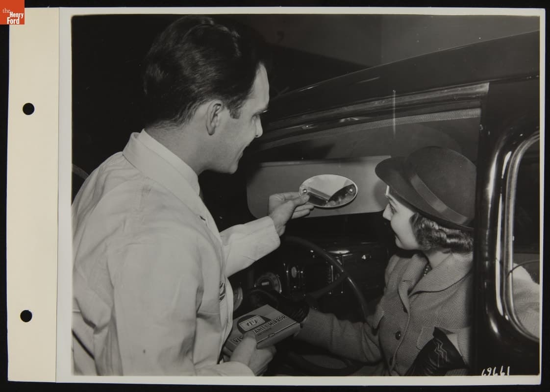 Service Attendant Showing Customer Visor Mirror, January 1938