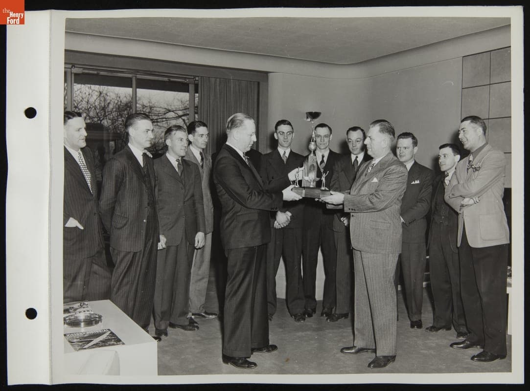 Mr. Coulton Presenting Trophy to Winning Ford Men's Basketball Team, Ford Rotunda, March 1944
