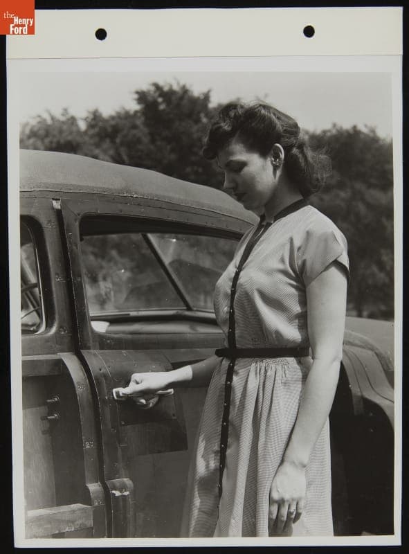 Woman Poses with Ford Automobile, August 1946