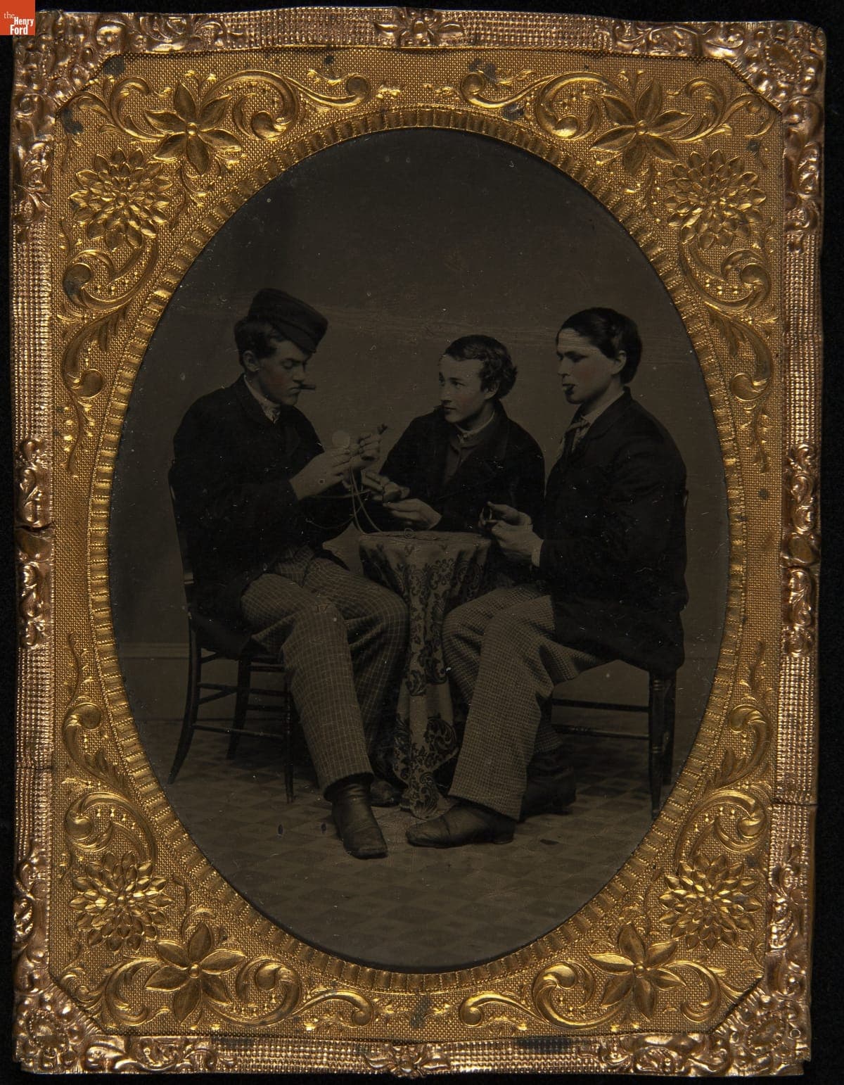 Three Teenage Boys Playing a Game, circa 1880