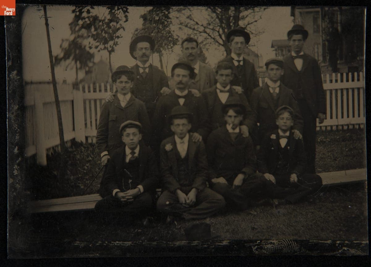 Group of Men and Boys in Front of a Picket Fence, circa 1895