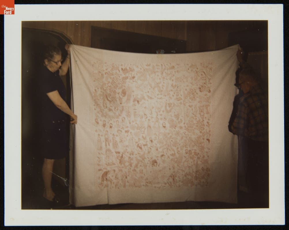 Ruth and Arthur McKesson Holding a Sheet Embroidered by Ruth's Grandmother, Susan McCord, circa 1973
