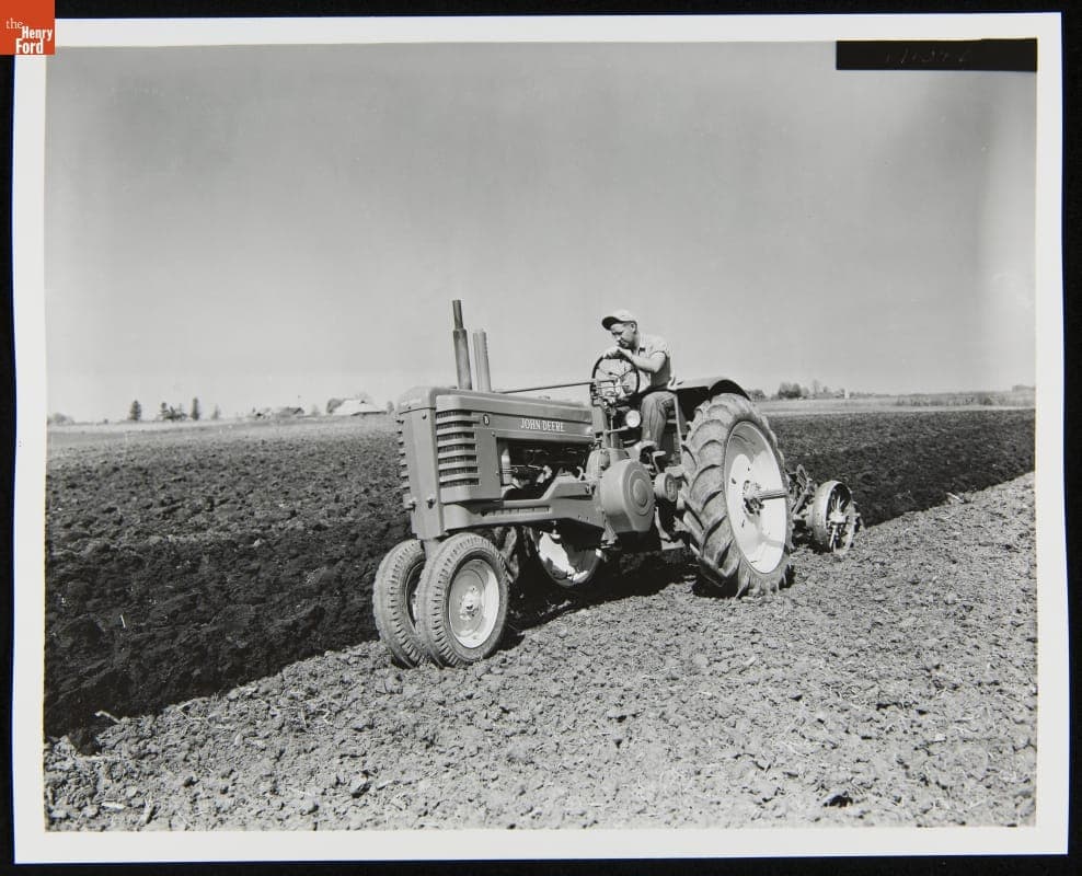 Man Using a 1947-1952 John Deere Model "B" Series Tractor