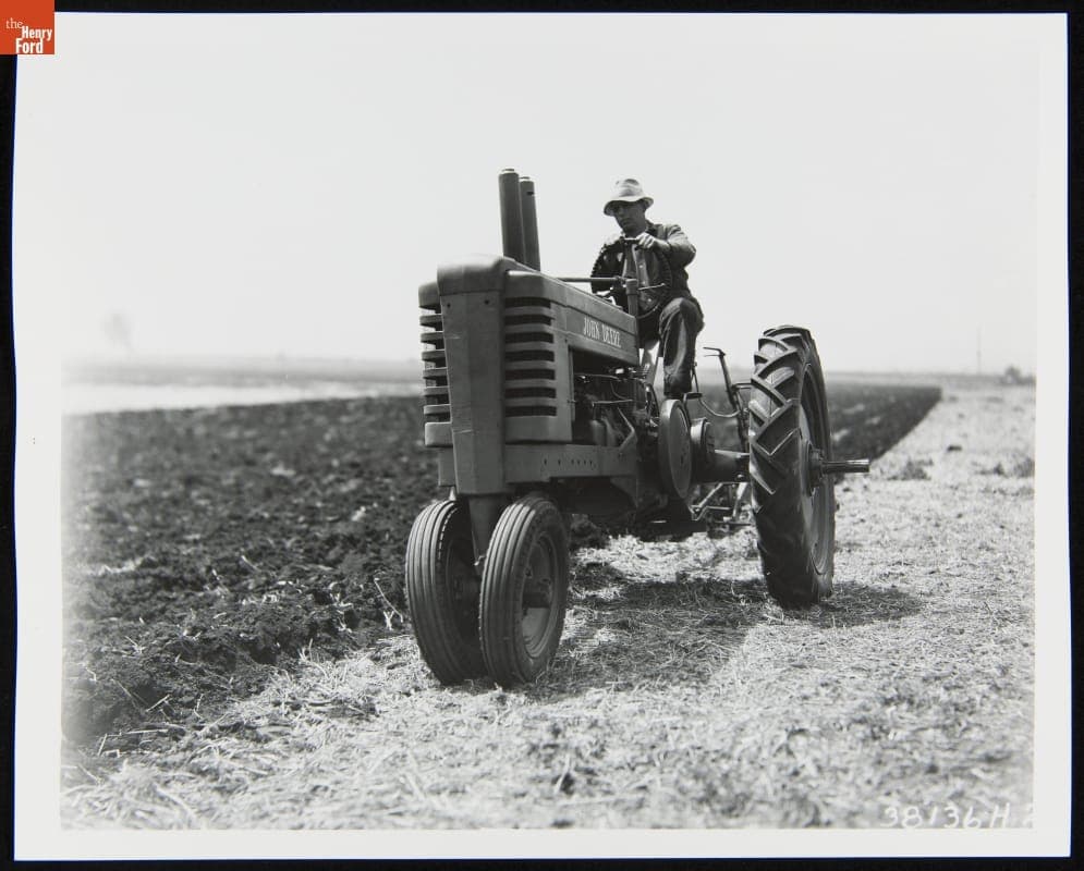 Man Using a 1939-1946 John Deere Model "B" Series Tractor