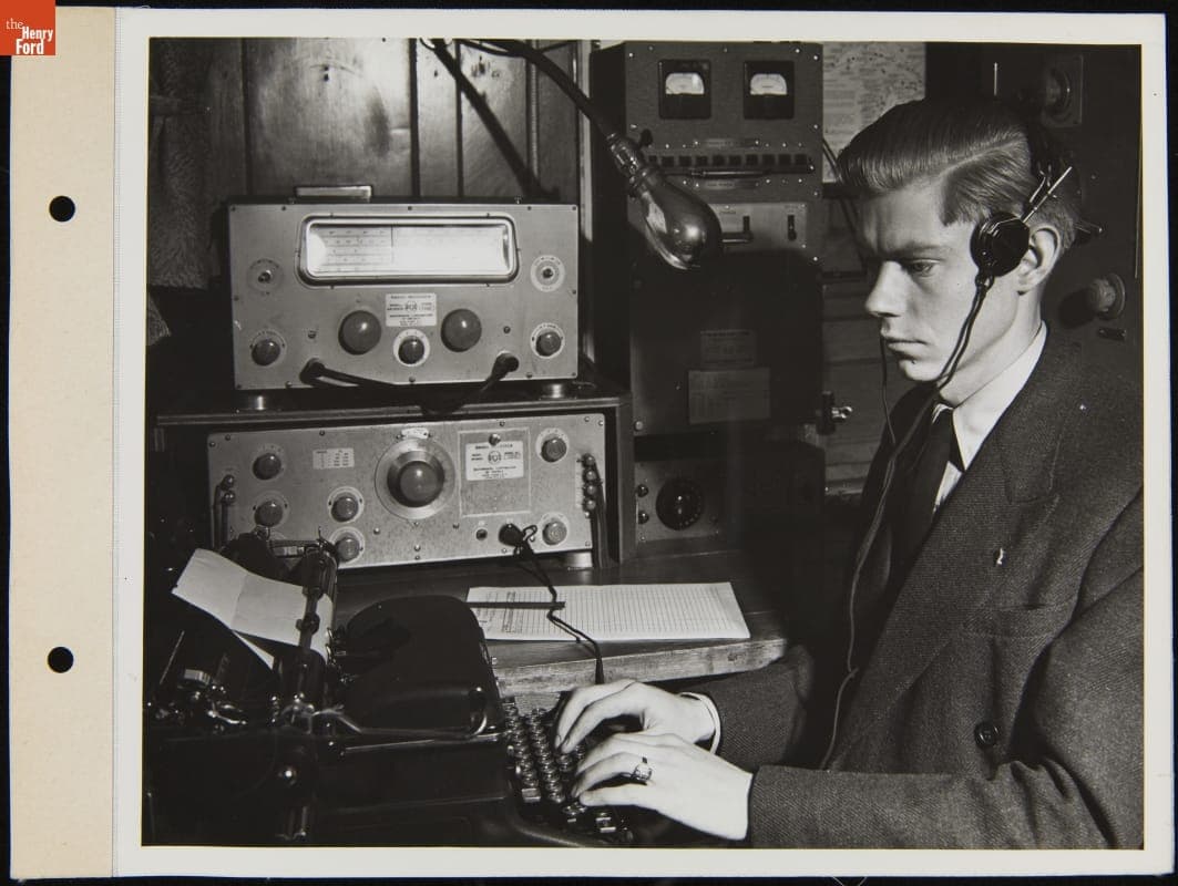 Radio Operator at a Typewriter aboard the Ford Motor Company Ship, "Benson Ford," April 1945