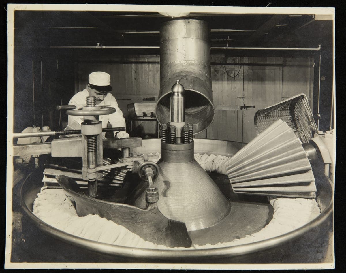 Employee Operating a Kneading Machine in the Main Plant's Spaghetti Department, H. J. Heinz Company, Pittsburgh, Pennsylvania, circa 1910