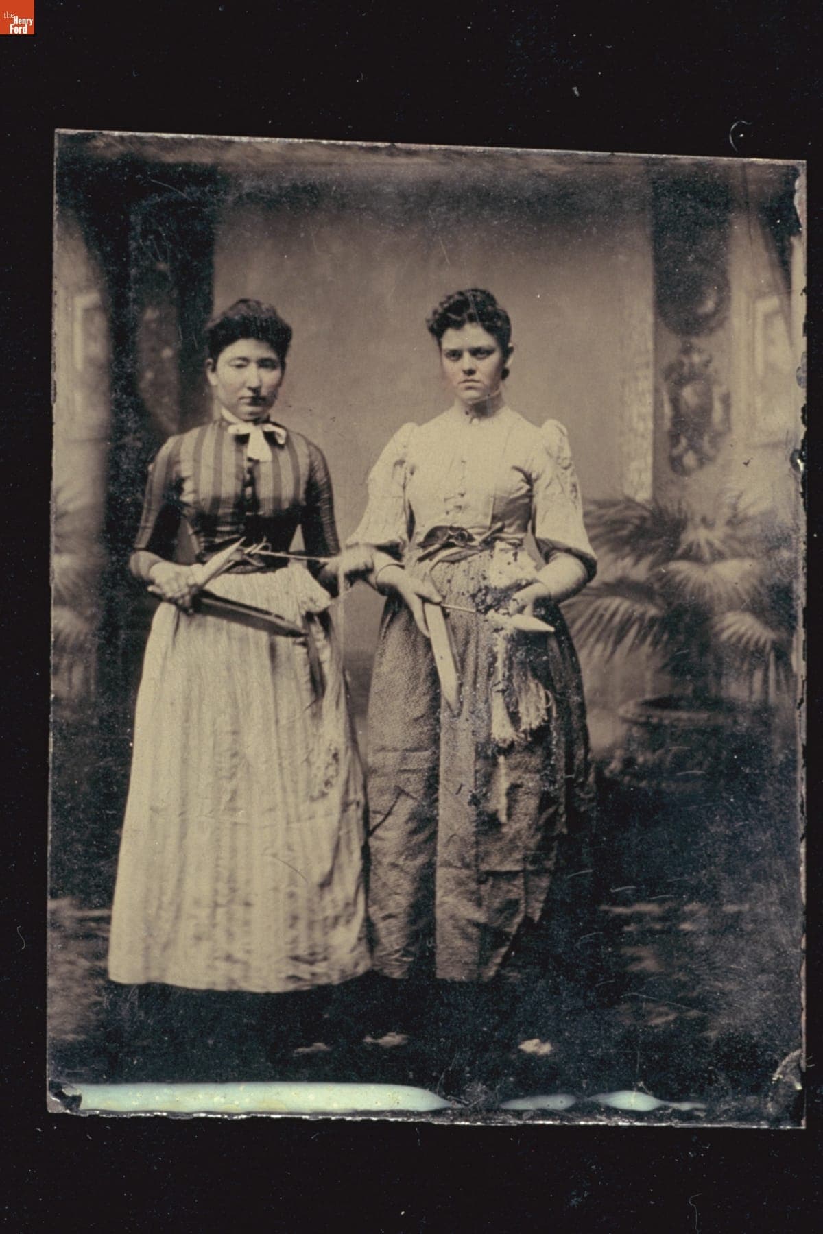 Two Women Posing with Textileworking Tools, circa 1892