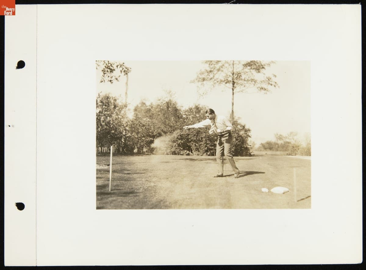 Man Spreading Ford Ammonium Sulphate Fertilizer on a Lawn, circa 1929