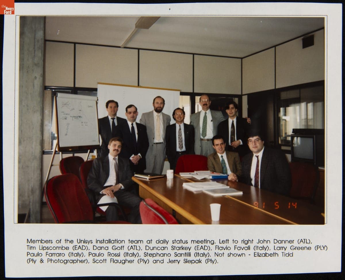 Members of the Unisys Installation Team at Daily Status Meeting, 1991