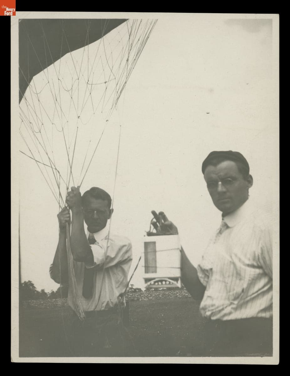 Two Men Holding a Weather Balloon and Equipment, 1915-1930
