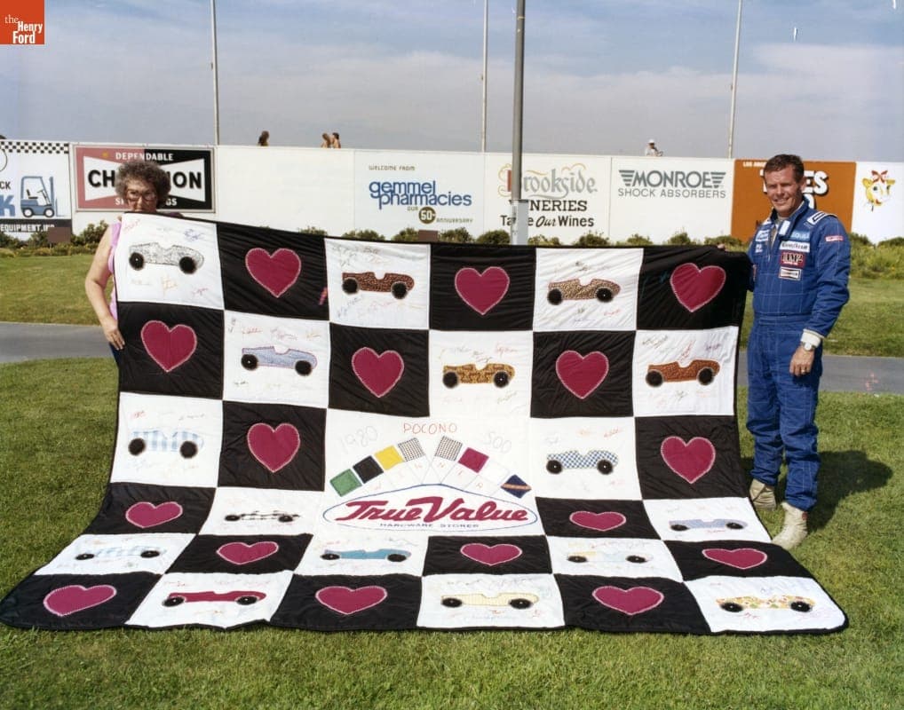 Bobby Unser with Quiltmaker Jeanetta Holder at Pocono in 1980