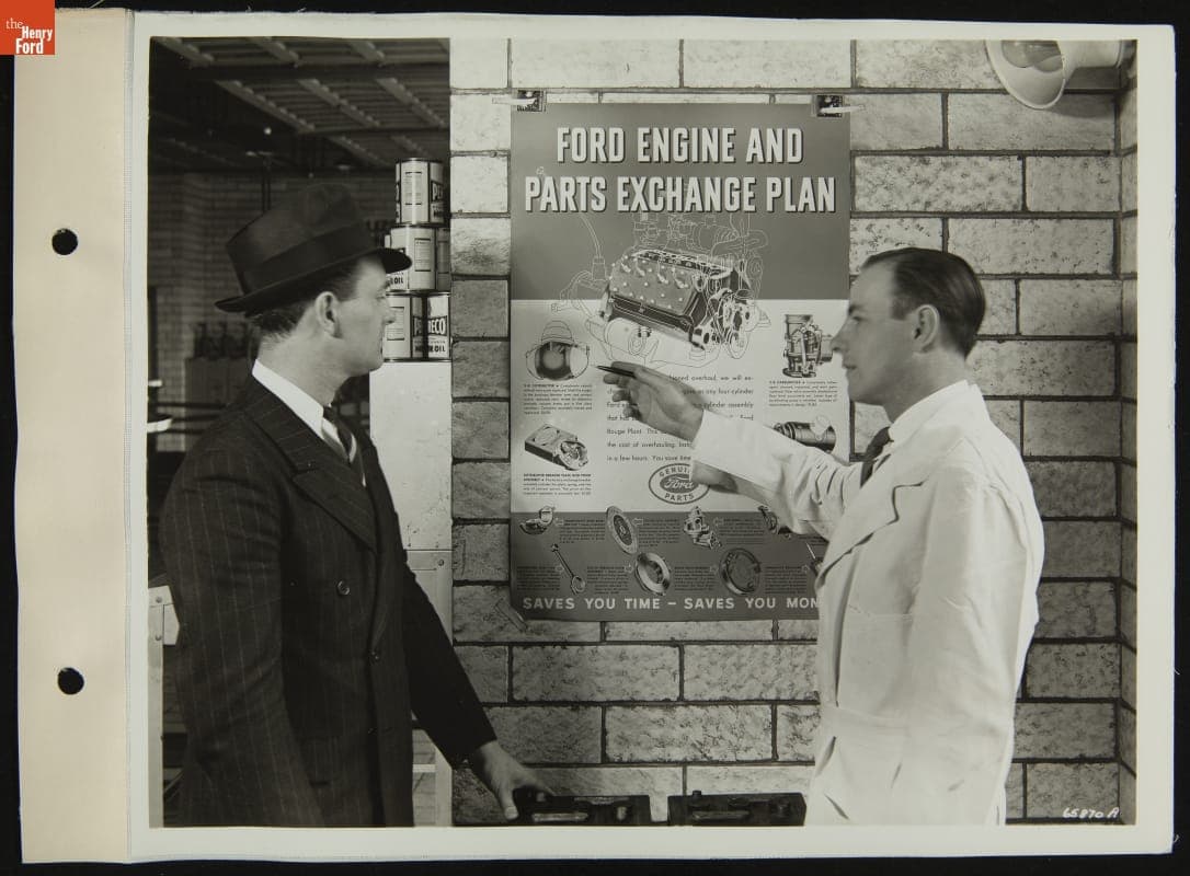 Service Station Attendant and Customer Discuss Ford Engine and Parts Exchange Plan, 1936