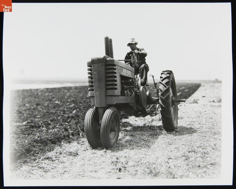 Man Using a 1939-1946 John Deere Model "B" Series Tractor