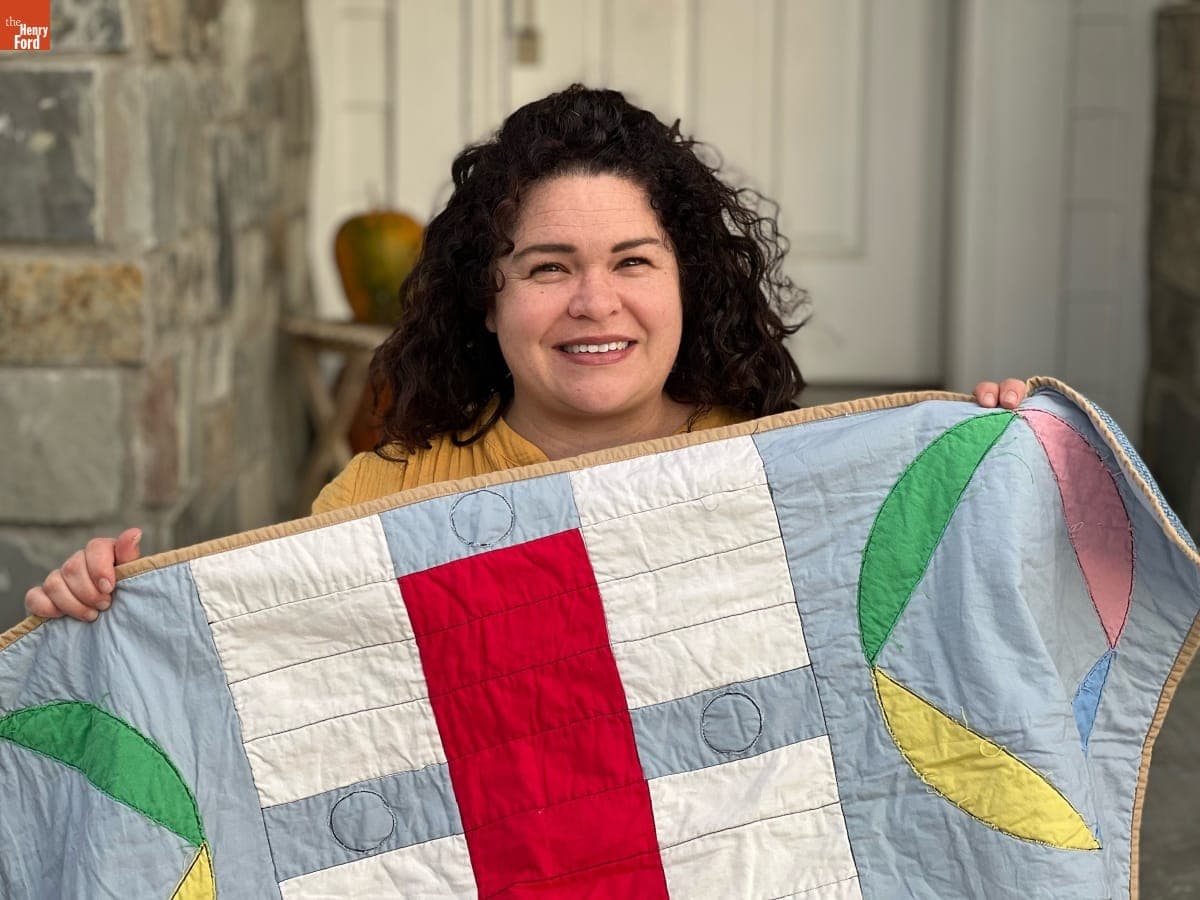 Kristen Sheffield Perschon Holding her Quilt, "Parcheesi"