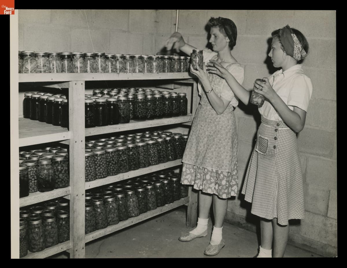 Macon (Michigan) High School Students Marjorie Korth and Joan Cadmus Organize Jars of Asparagus on Shelves, August 1943