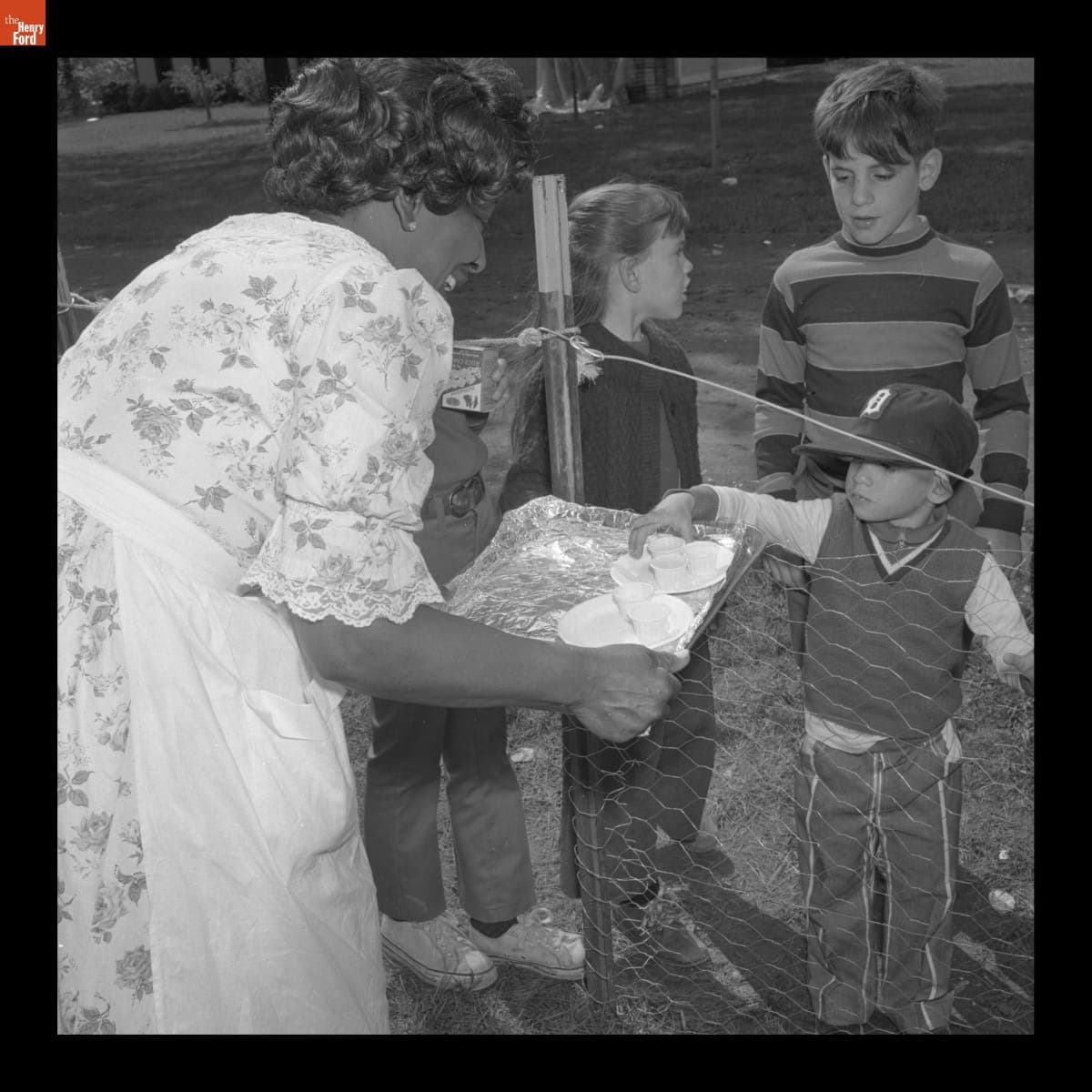 Pauline Taylor Serving Buttermilk to Visitors at the Greenfield Village Country Fair, May 1971