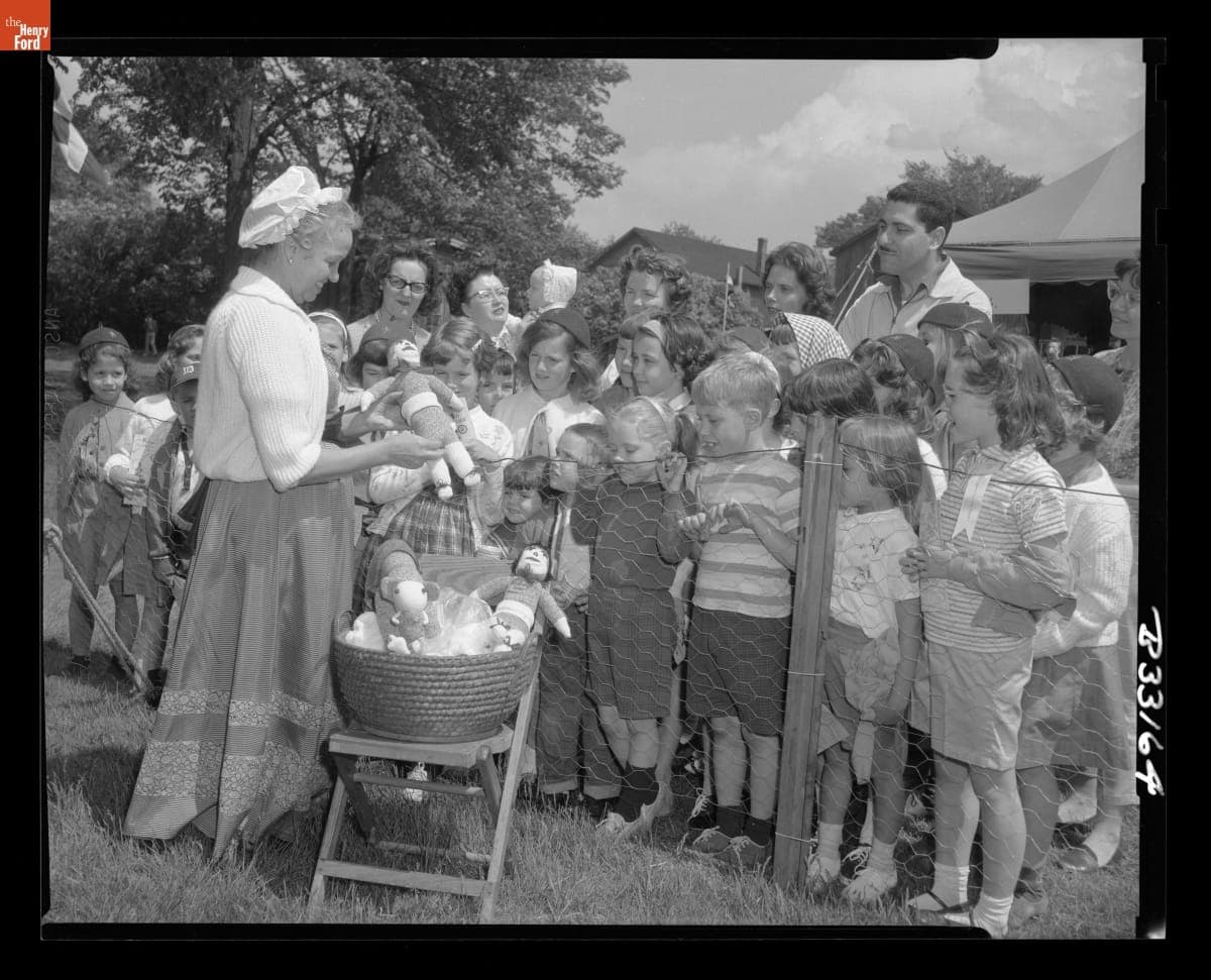 Yvonne Prieur Showing Stocking Dolls at the Greenfield Village Country Fair, May 1963