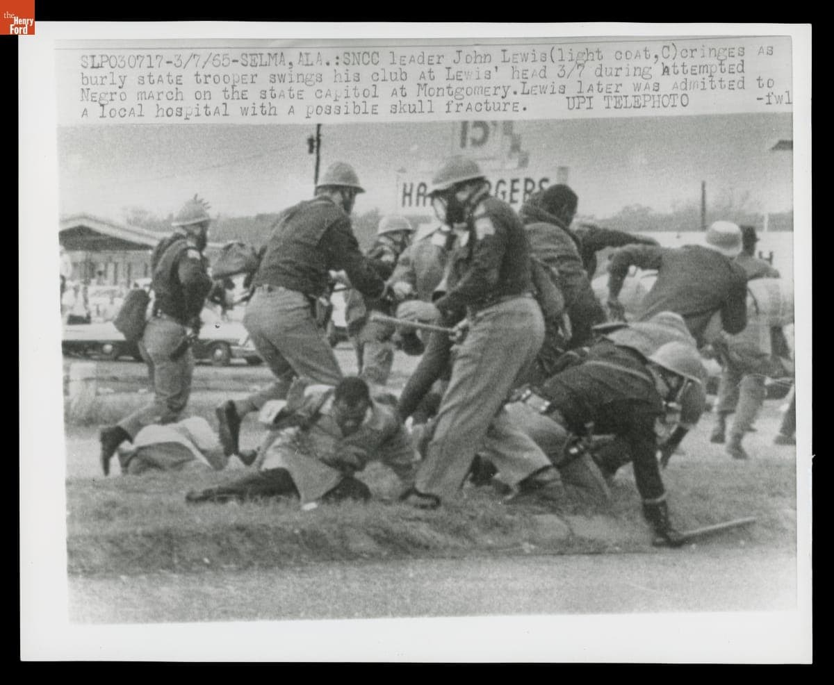 State Trooper Swings Club at the Head of SNCC Leader John Lewis during Attempted March from Selma to Montgomery, March 7, 1965