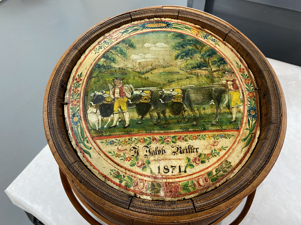 A decorative milk pail from the Gwinn Dairy Collection after restoration.