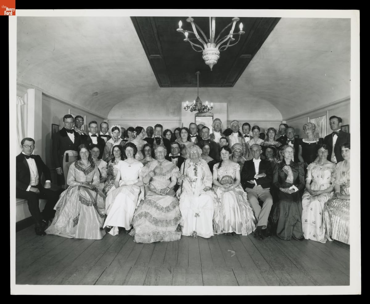 Dressed in 19th-century clothing, Henry, his wife, Clara, and their guests in the ballroom of the Wayside Inn in Sudbury, Massachusetts, in 1926.