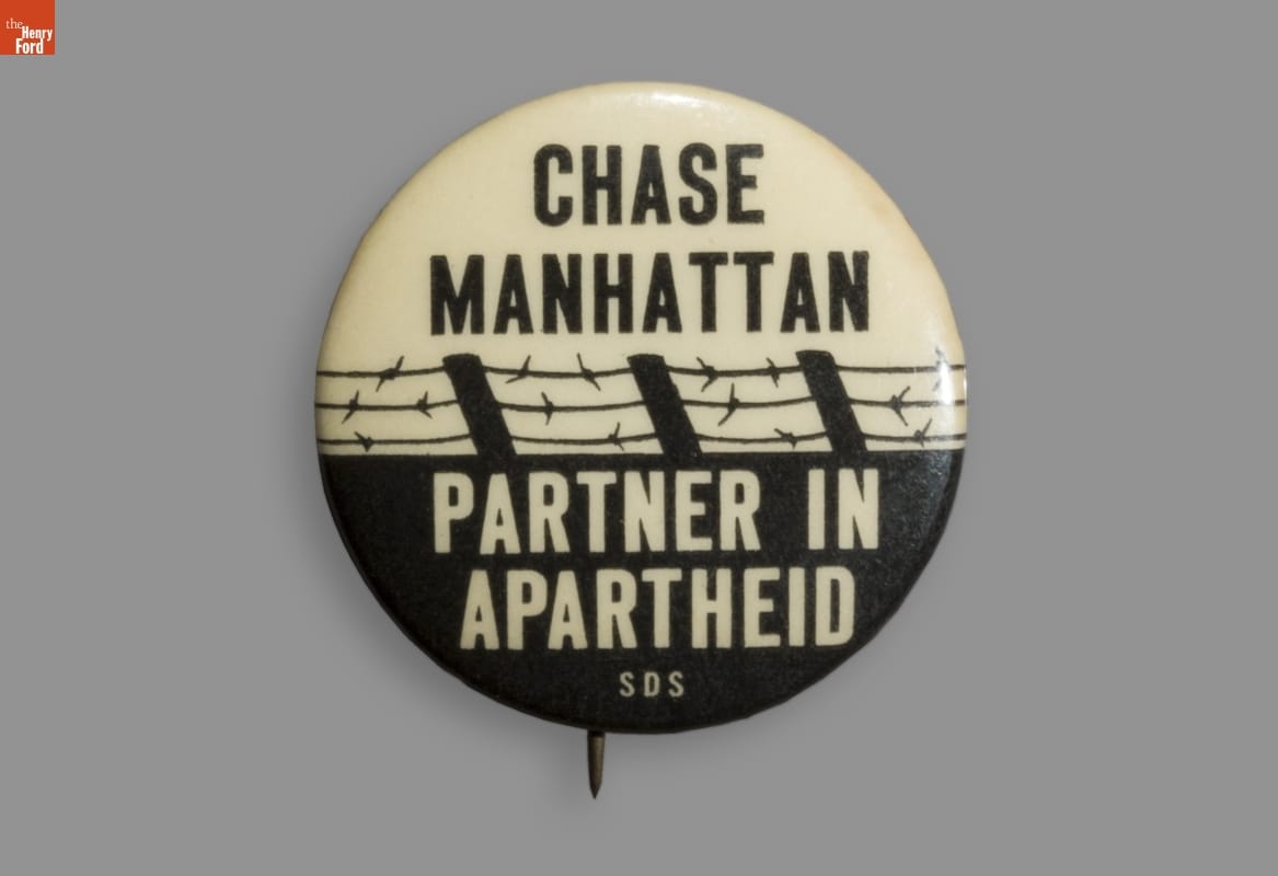 Button, 'Chase Manhattan Partner in Apartheid,' circa 1965, created by Students for a Democratic Society. title=