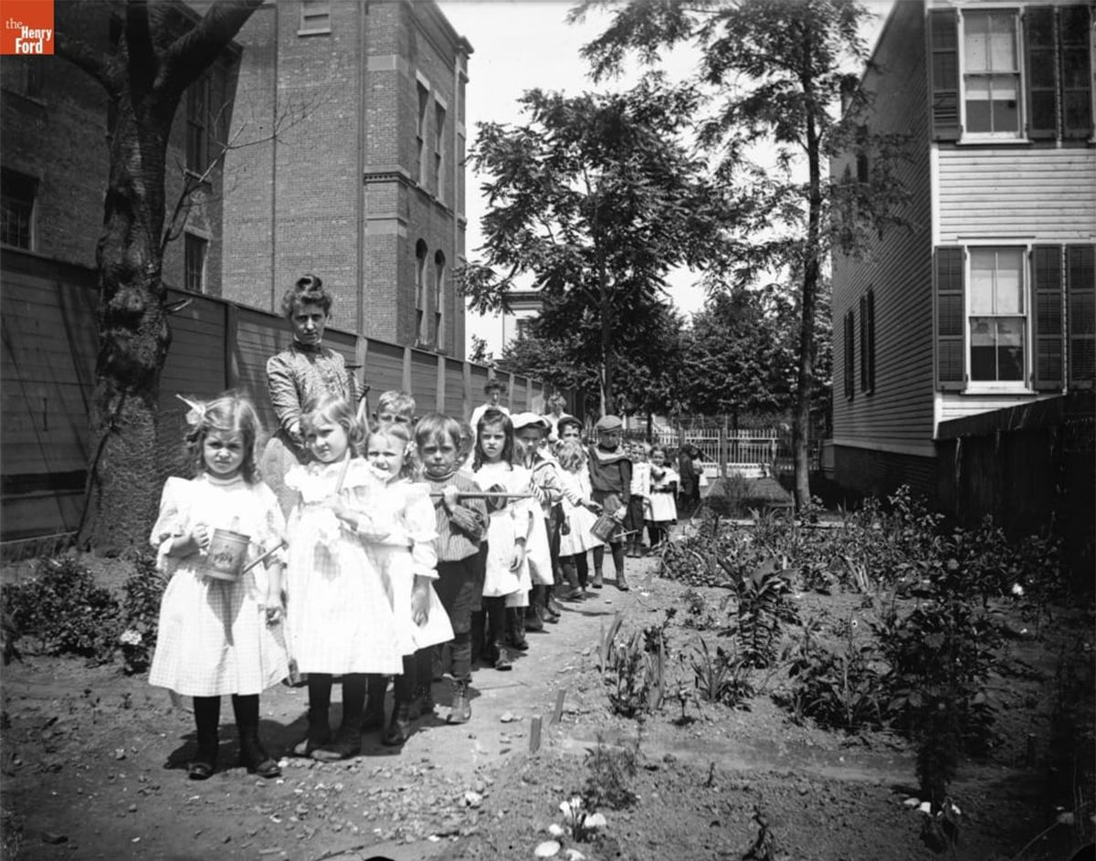 Students in the school garden outside Public School 65, Brooklyn, New York, 1890-1915