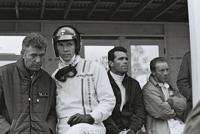 Carroll Shelby and Dan Gurney in conversation at Le Mans 1966.