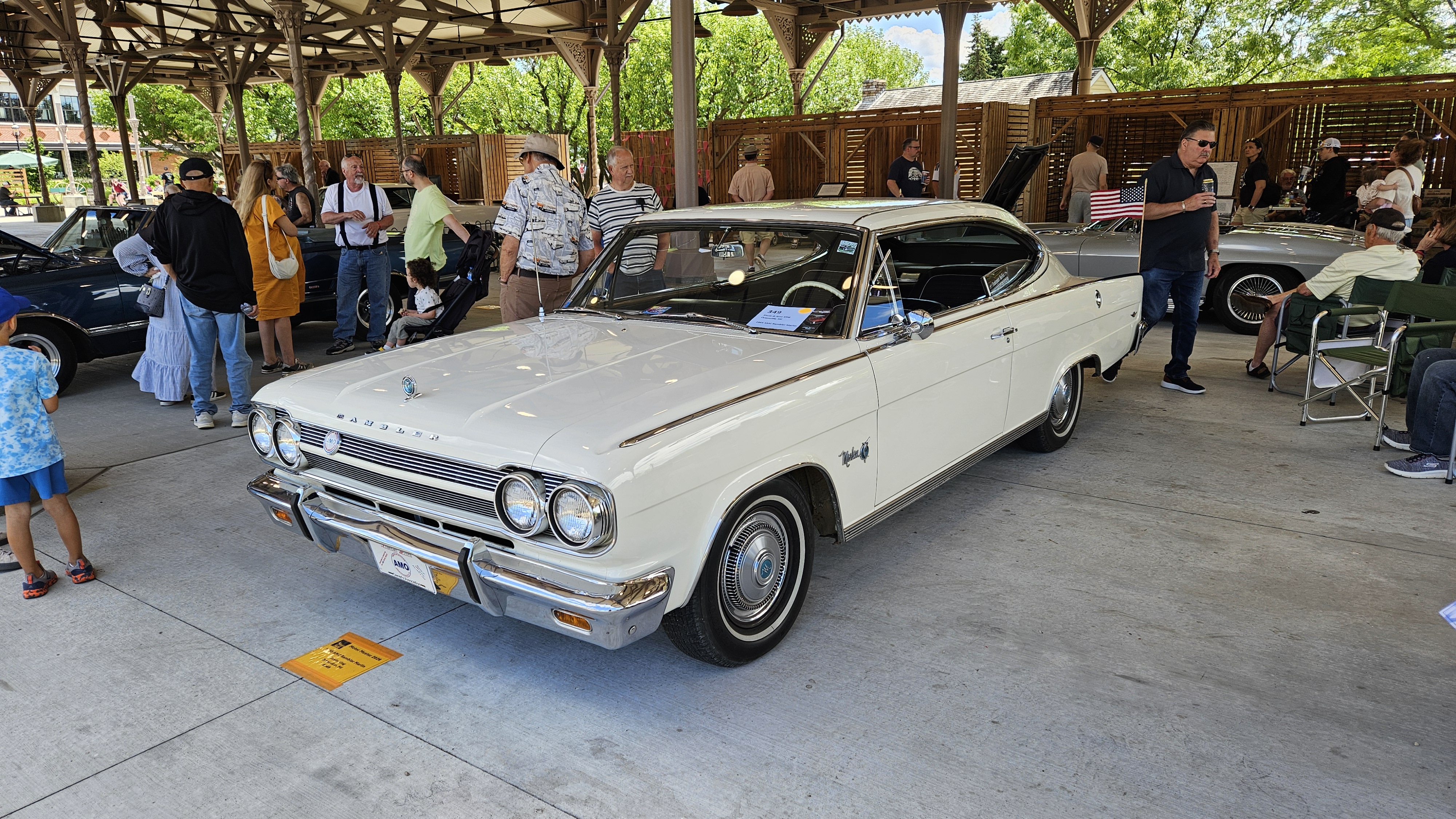 20260620_145929 A 1965 AMC Rambler Marlin on display at Detroit Central Market during Motor Muster 2026 in Greenfield Village.