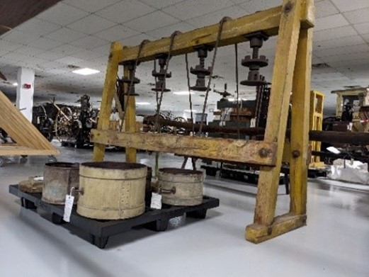 Cheese press with hoops that produce different sizes of cheeses