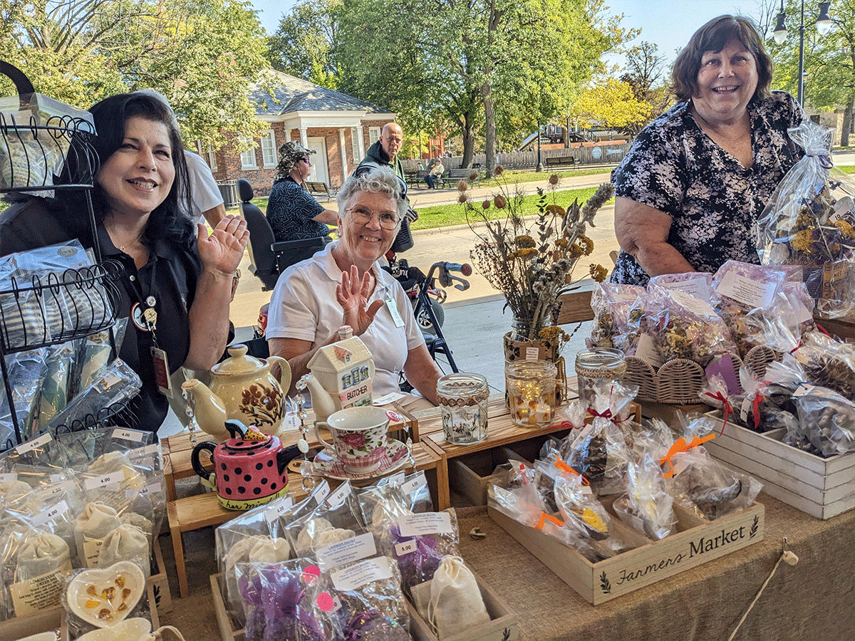 Village Herb Associates members and some of the products created by members for sale during the 2025 September market weekend.