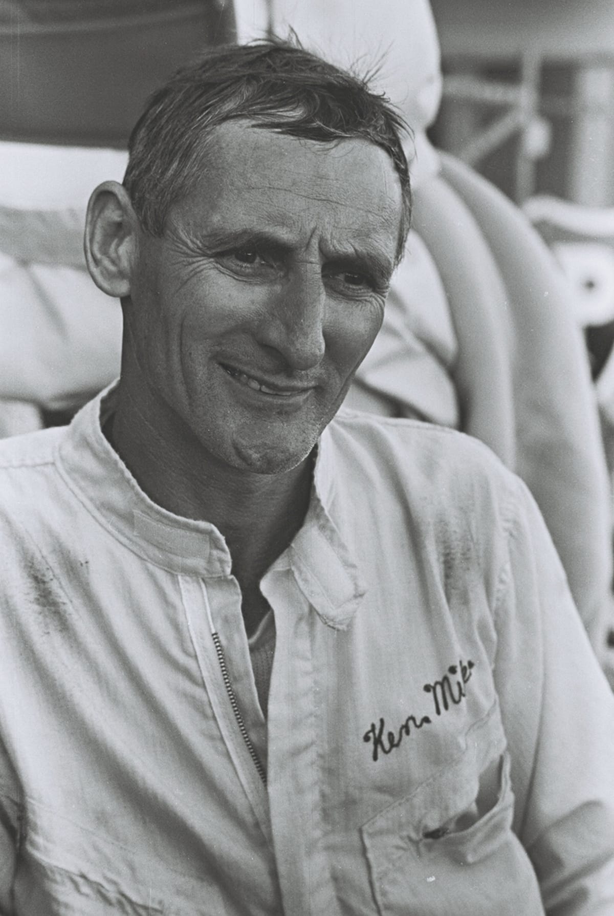 Black-and-white photo of smiling man