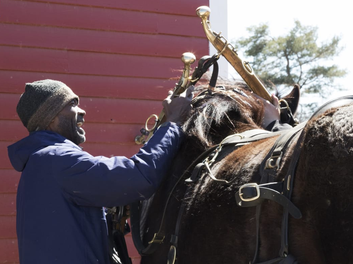 Melvin Parson petting a horse