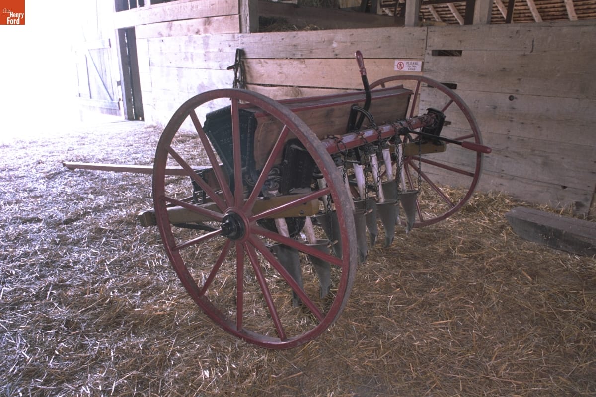 Bickford & Huffman Grain Drill, circa 1890 Wooden equipment on wheels, with many cone-shaped devices pointing downward