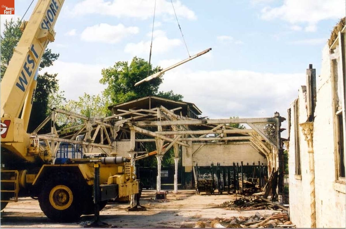 Dismantling the Riding Stable (Originally the Detroit Central Market Building) at Belle Isle, Detroit, Michigan, 2003 Crane removing large beam from largely dismantled structure