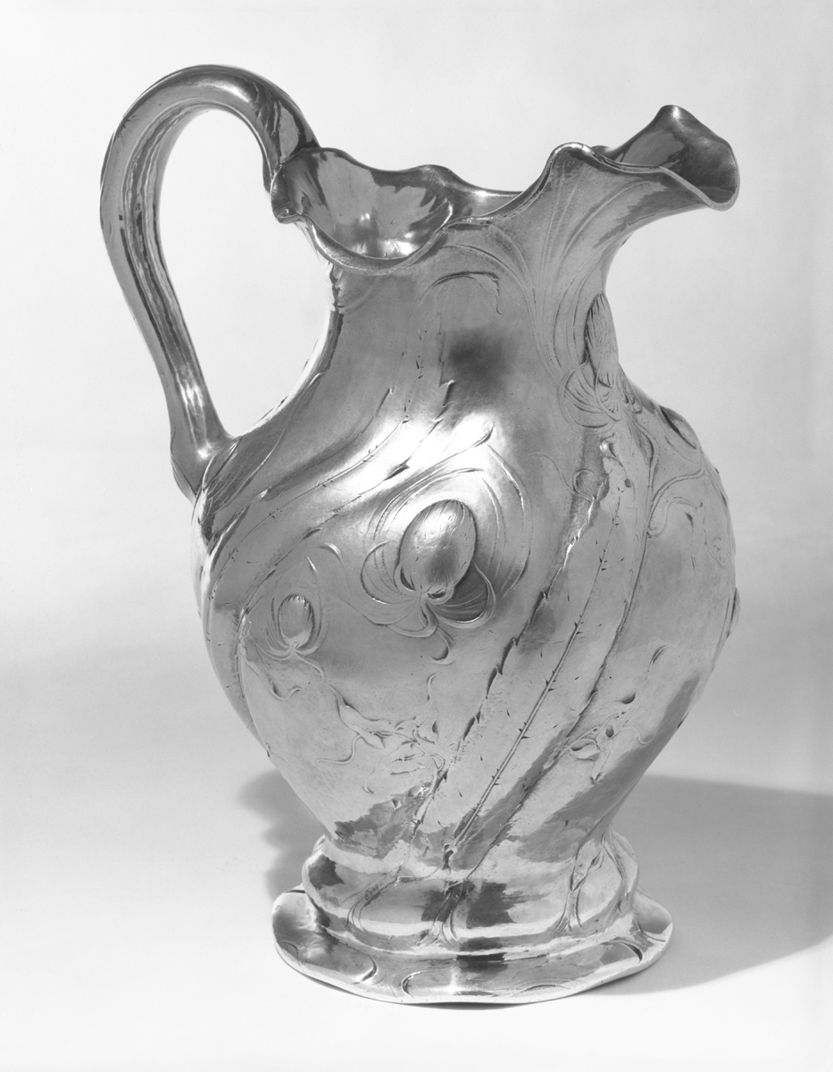 Martele Pitcher, 1898-1905 Silver pitcher with swirling decorative images, including octopus